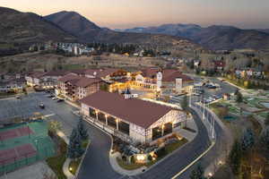 Aerial view at dusk featuring a mountain view
