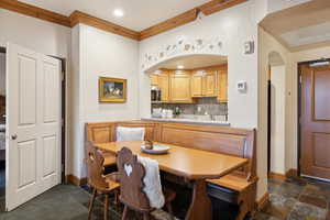 Dining area with ornamental molding