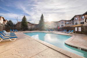 View of swimming pool featuring a patio