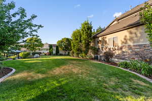 View of yard with central AC