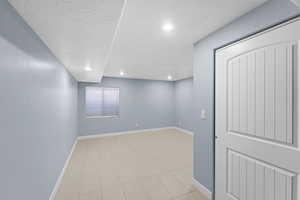 Spare room with a textured ceiling