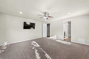 Interior space with carpet and ceiling fan