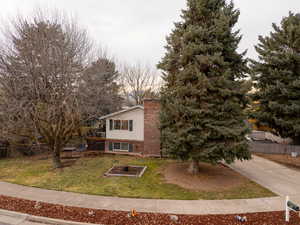 View of front of home featuring a front lawn