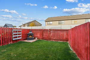 View of yard with a fireplace