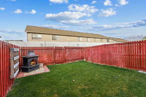 View of yard with a fireplace and a mountain view