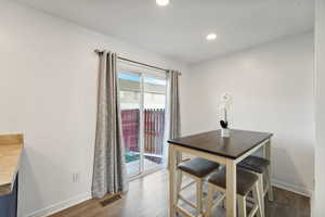 Dining area featuring wood-type flooring