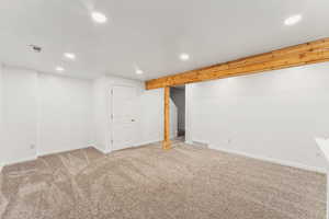 Basement with carpet flooring