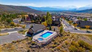 Birds eye view of property with a mountain view