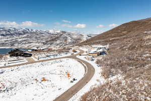 Snowy aerial view featuring a mountain view