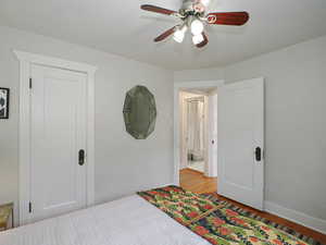 Bedroom featuring ceiling fan and light wood-type flooring