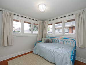 Bedroom with hardwood / wood-style floors