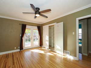 Bedroom 3 with French doors leading to the deck.