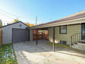 View of garage and covered patio.