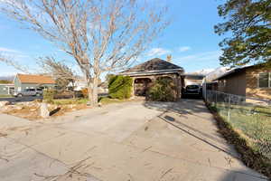 View of front of home featuring a carport