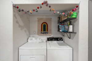 Laundry room featuring separate washer and dryer