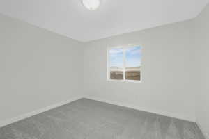 Empty room with carpet floors