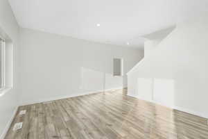 Unfurnished room with light wood-type flooring