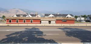 View of parking / parking lot with a mountain view