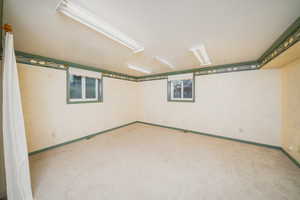 Basement featuring carpet flooring