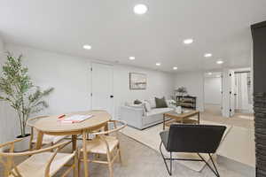 Living room featuring light colored carpet