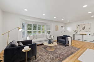 Living room with hardwood / wood-style floors