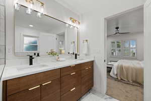 Bathroom with vanity and ceiling fan