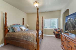 View of carpeted bedroom