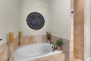 Bathroom with a relaxing tiled tub