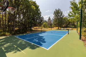 View of tennis court with basketball court