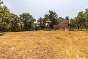 View of yard with a rural view