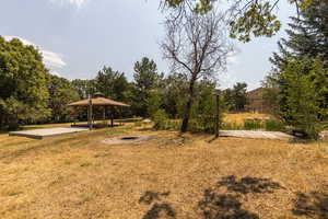 View of yard featuring a gazebo and an outdoor fire pit