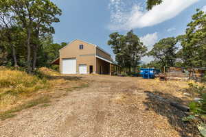 View of outbuilding featuring a garage