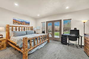 Primary Bedroom with walkout to back patio.