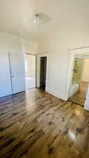 Unfurnished bedroom with wood-type flooring