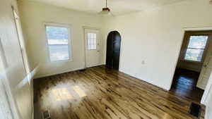 Spare room with dark hardwood / wood-style floors