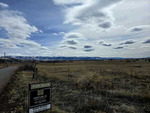 Property view of mountains with a rural view