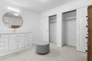 Interior space featuring vanity and crown molding