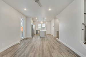 Unfurnished living room featuring light hardwood / wood-style floors