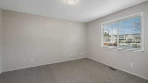 Unfurnished room featuring carpet