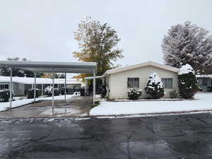 Exterior space featuring a carport