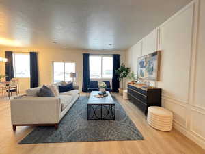 Living room with light wood-type flooring