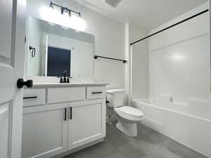 Full bathroom with washtub / shower combination, vanity, and toilet