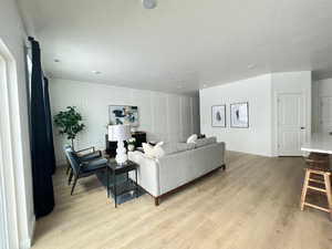 Living room with light hardwood / wood-style flooring