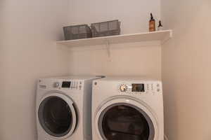 Laundry area featuring washing machine and clothes dryer