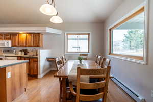 Sun lit dining area with door to back patio