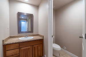 basement full bathroom with separate toilet room