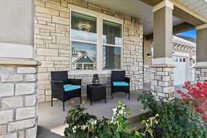 View of patio / terrace with a 3-car garage