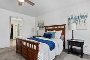 Bedroom featuring ceiling fan and light colored carpet