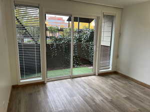 Empty room with wood-type flooring