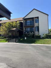 View of front of home featuring a balcony